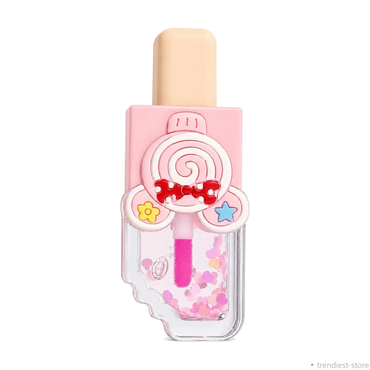 A novelty lip gloss bottle shaped like a lollipop, featuring a pink body with a clear lower section filled with pink heart-shaped glitter. The top cap is a solid pale peach-beige color, and the front is decorated with a 3D white lollipop, a red bow, and small star and flower embellishments.