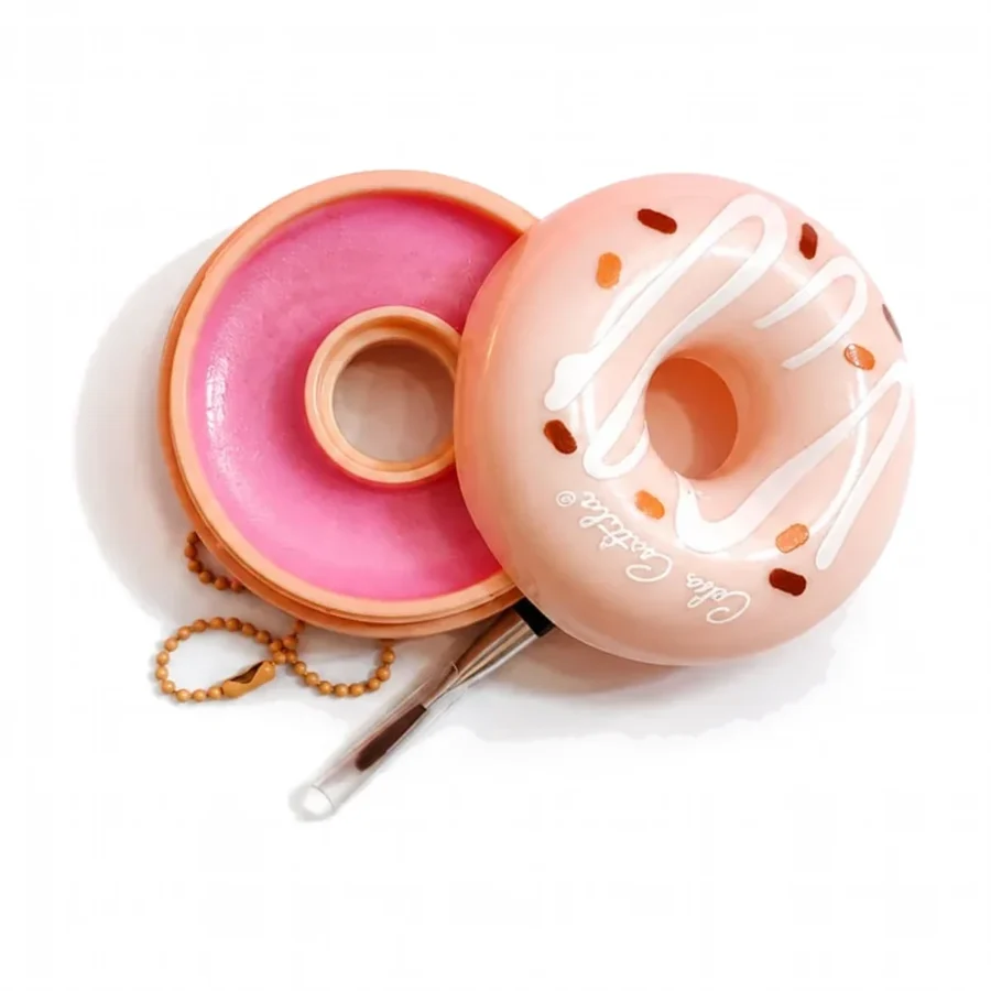 Peach donut lip balm opened showing pink tinted balm and lip brush