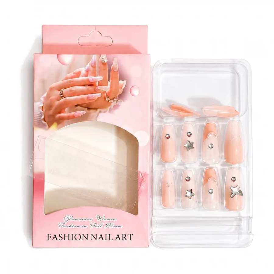 Press-on nails in peach with silver star charms