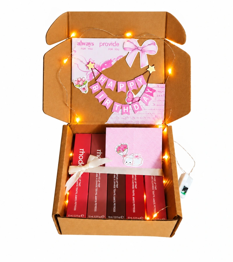 Complete Rhode lip tint gift box with full lid, ribbon, card and fairy lights on white